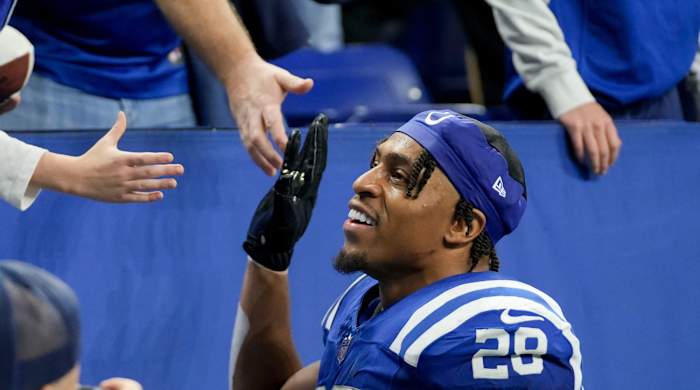 Colts running back Jonathan Taylor high-fives fans after a win over the Buccaneers.